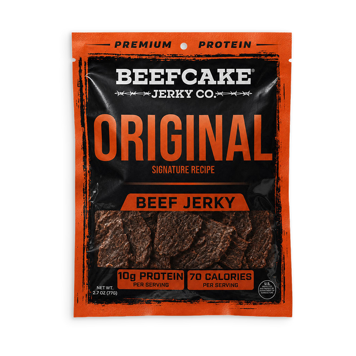A package of Beefcake Jerky Co. Original Beef Jerky, featuring a black and orange pouch with a clear window showing the dark brown jerky strips inside.
