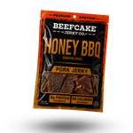 A package of Beefcake Jerky Co. Honey BBQ Pork Jerky, shown floating against a plain white background with a soft shadow.
