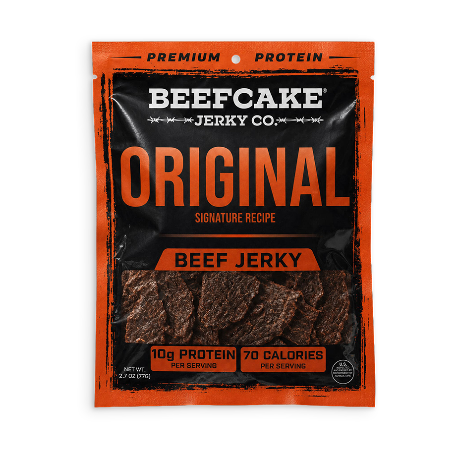 A package of Beefcake Jerky Co. Original Beef Jerky, featuring a black and orange pouch with a clear window showing the dark brown jerky strips inside.