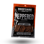 A package of Beefcake Jerky Co. Peppered Beef Jerky, shown at a three-quarter angle on a clean white background with a soft drop shadow.