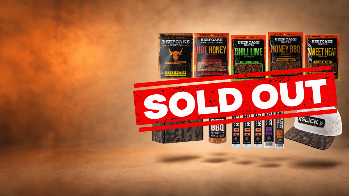 Slick x Beefcake bundle with jerky, meat sticks, Sweet BBQ seasoning, a Slick hat, and a camo box.