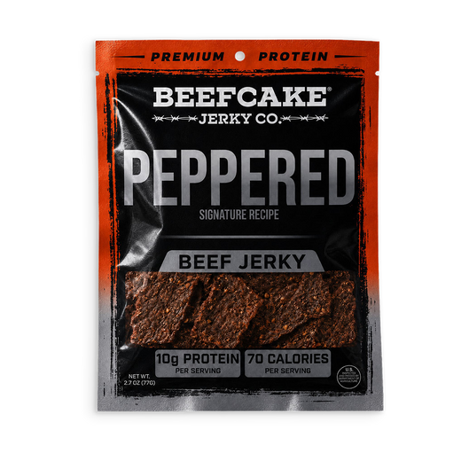 A package of Beefcake Jerky Co. Peppered Beef Jerky, featuring a black and orange resealable pouch with a clear window showing the textured, reddish-brown jerky pieces inside.
