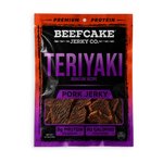 A package of Beefcake Jerky Co. Teriyaki Pork Jerky, featuring a black and purple bag with a red-orange border, showing the jerky pieces through a clear window.