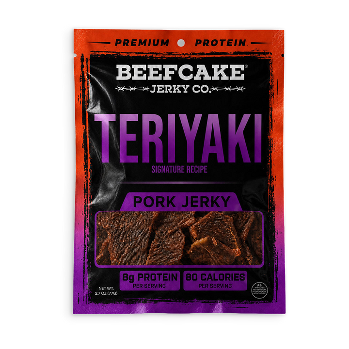 A package of Beefcake Jerky Co. Teriyaki Pork Jerky, featuring a black and purple bag with a red-orange border, showing the jerky pieces through a clear window.